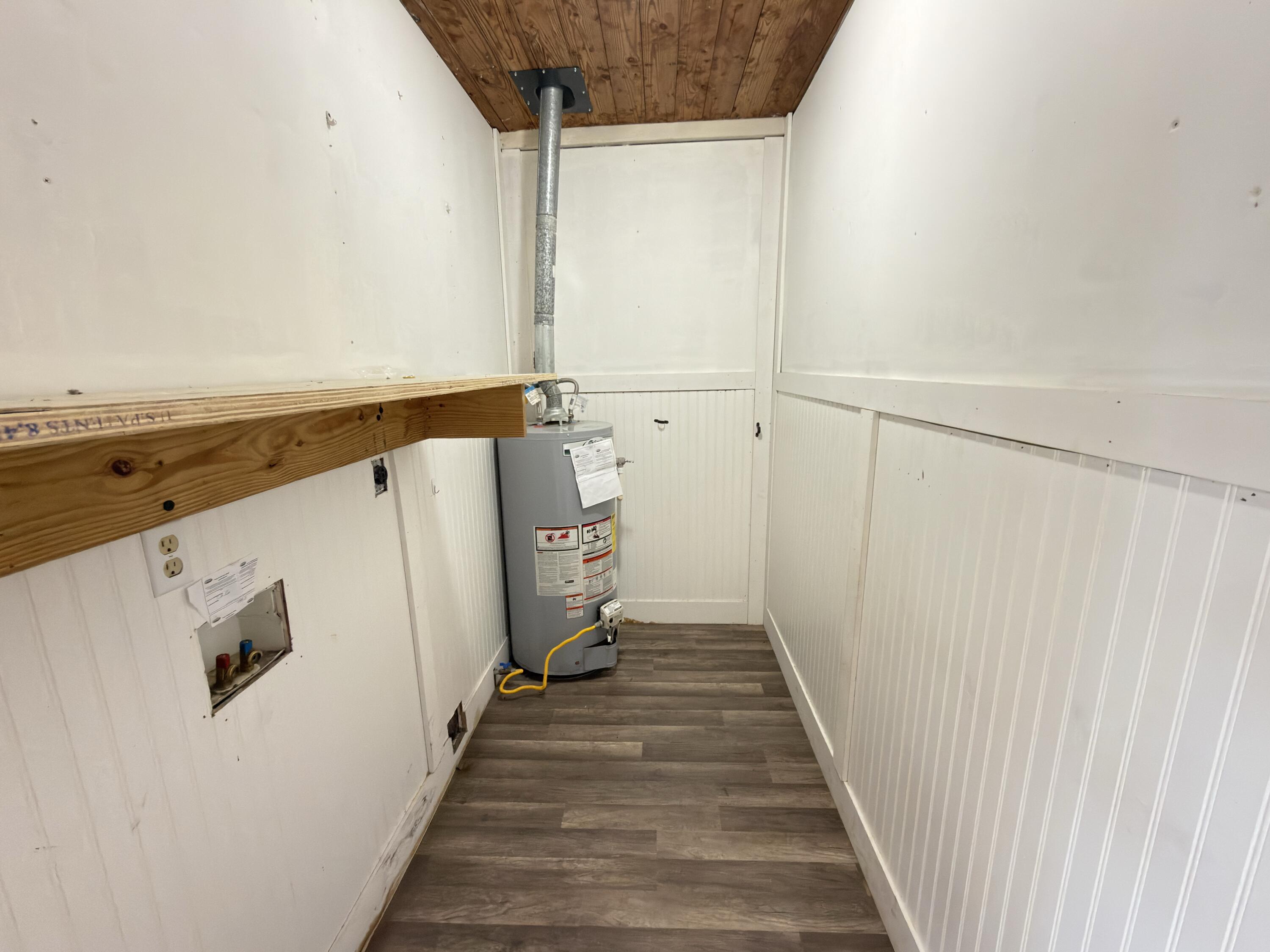 515 Robinson Avenue East Crestview, FL 32539 - Photo 12 of 22 a view of a hallway with wooden floor