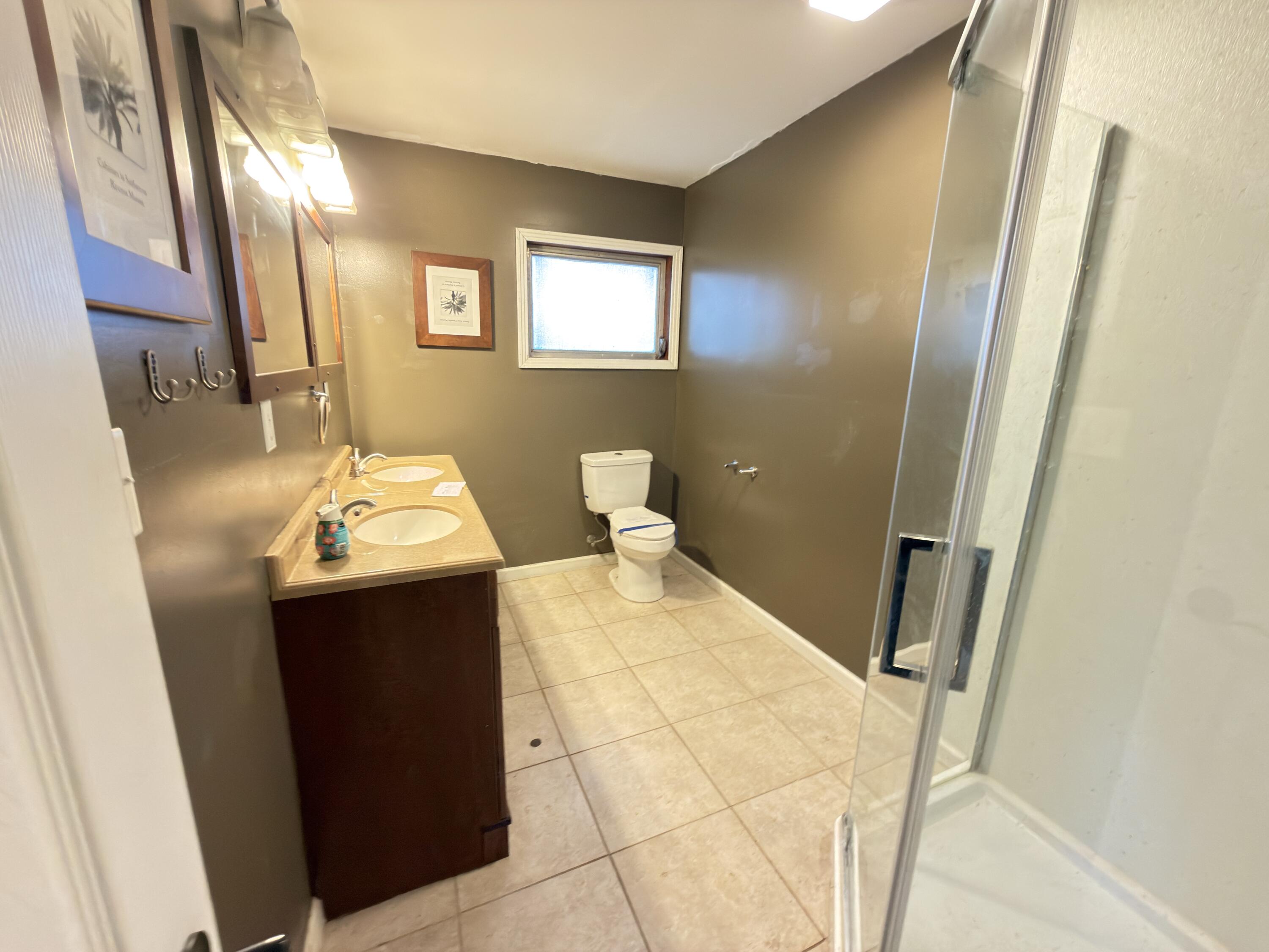 515 Robinson Avenue East Crestview, FL 32539 - Photo 15 of 22 a bathroom with a sink toilet and mirror