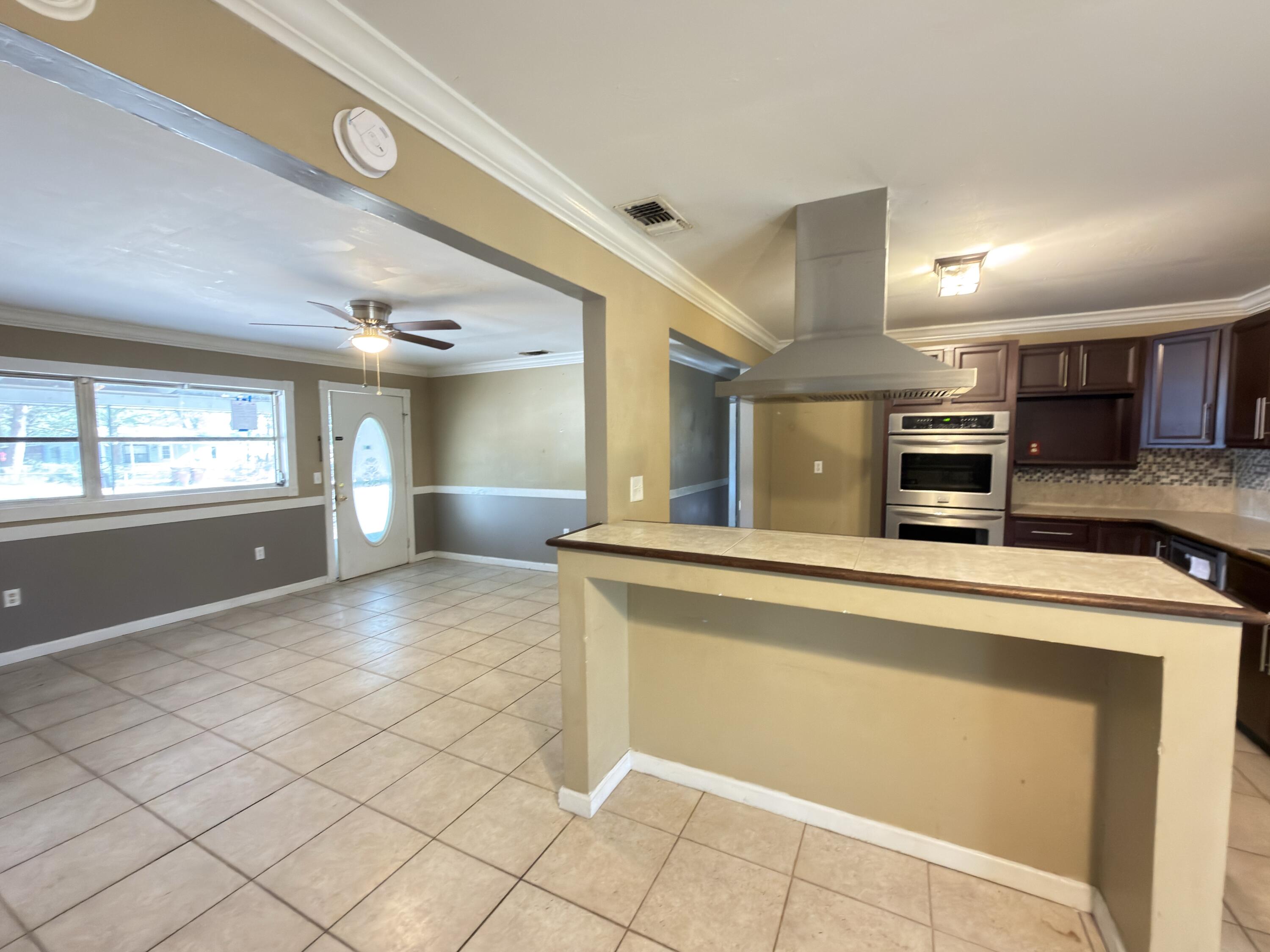 515 Robinson Avenue East Crestview, FL 32539 - Photo 5 of 22 a view of a kitchen with a sink and cabinets
