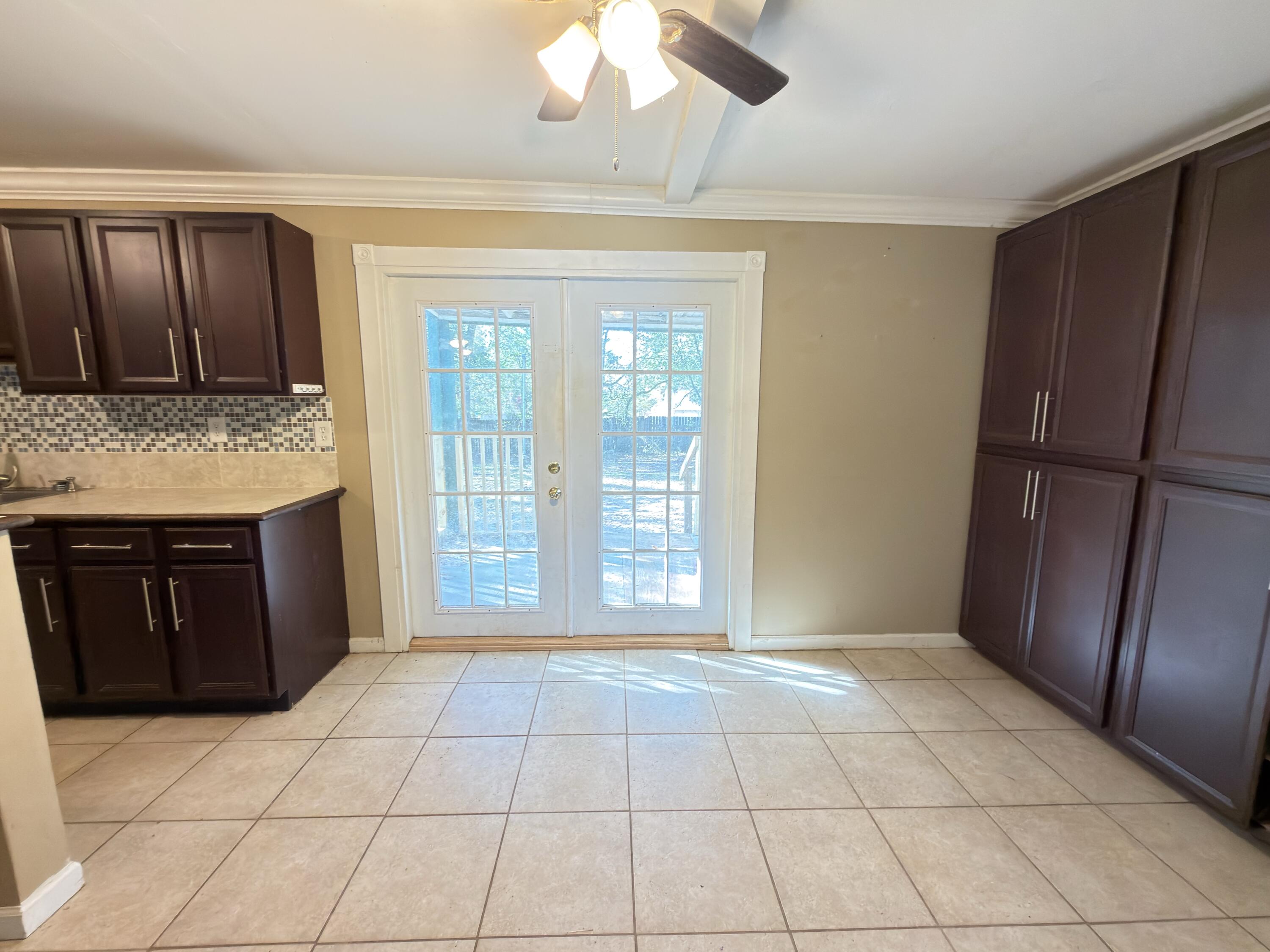515 Robinson Avenue East Crestview, FL 32539 - Photo 7 of 22 a view of kitchen with granite countertop cabinets and refrigerator