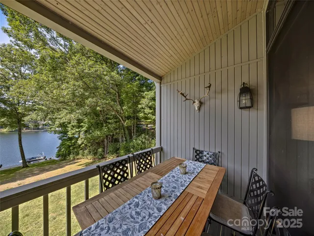 a view of balcony with wooden floor