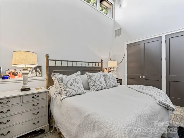 a bedroom with a bed and a closet