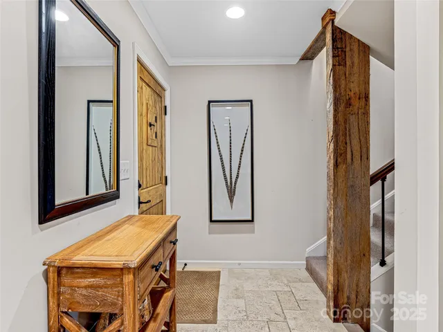 a room with pool table and windows