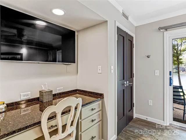 a view of a kitchen with a sink and cabinets