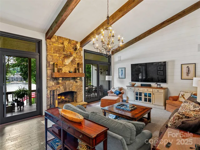 a living room with furniture fireplace and flat screen tv