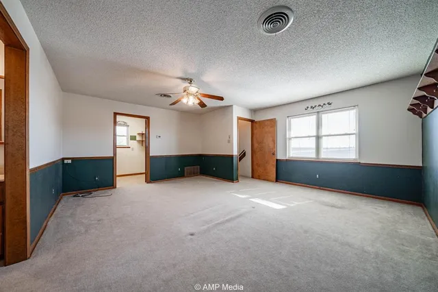 a kitchen with a sink and a refrigerator