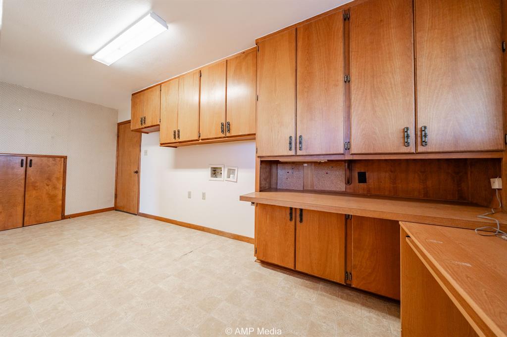 1102 Elmdale Road North Abilene, TX 79601 - Photo 17 of 28 a view of a kitchen with stainless steel appliances granite countertop wooden cabinets and a sink