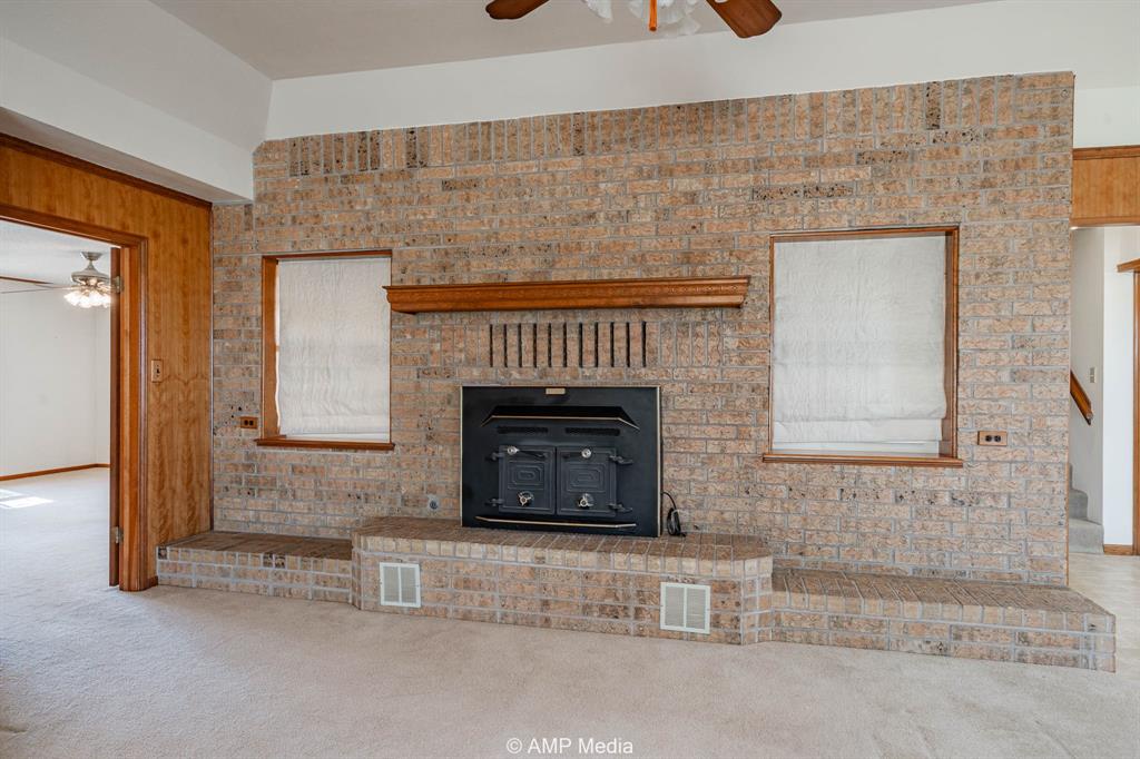 1102 Elmdale Road North Abilene, TX 79601 - Photo 2 of 28 a living room with a fireplace