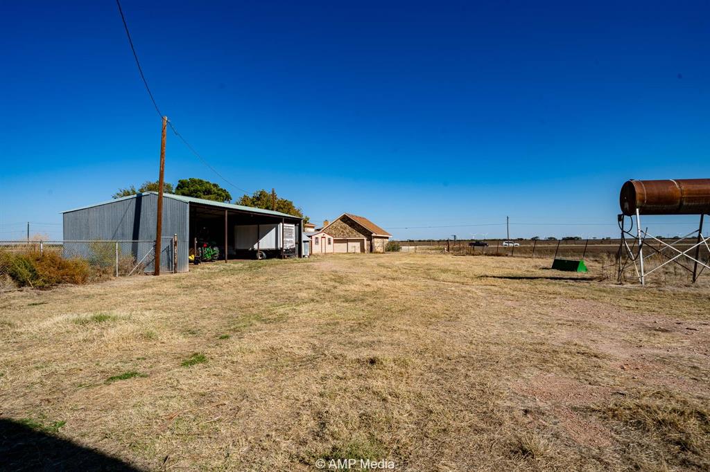 1102 Elmdale Road North Abilene, TX 79601 - Photo 22 of 28 a backyard of a house with table and chairs