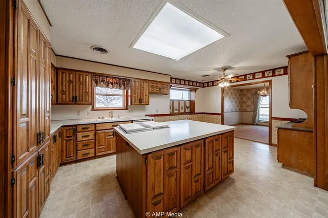 a kitchen with a stove and a refrigerator