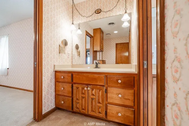 a bathroom with a toilet and shower