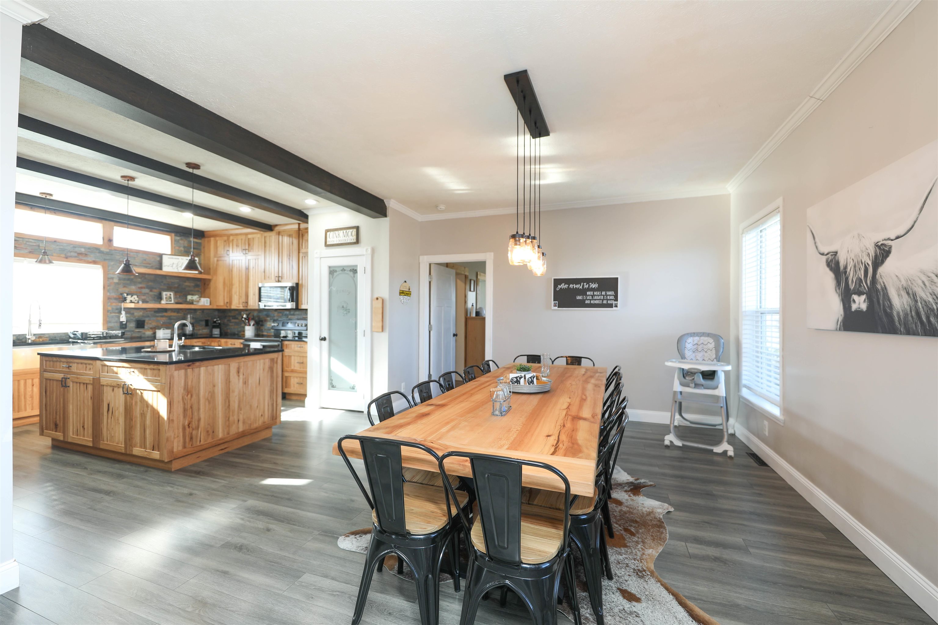 450 Steeles Fort Road Raphine, VA 24472 - Photo 25 of 52 a kitchen with stainless steel appliances kitchen island granite countertop a table chairs and a refrigerator