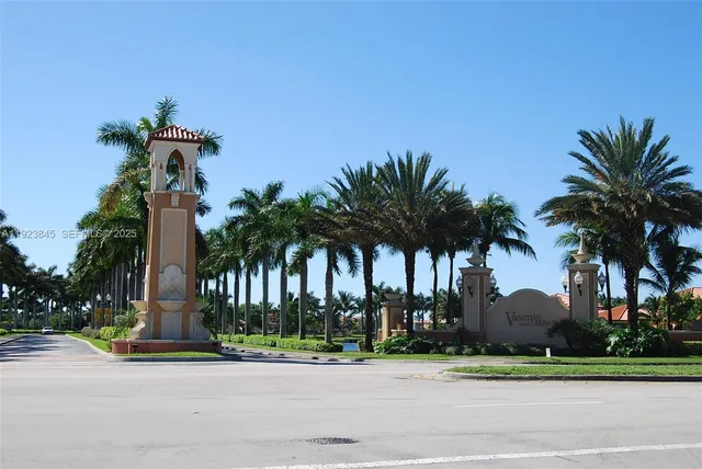a palm trees sitting in front of a house with a yard