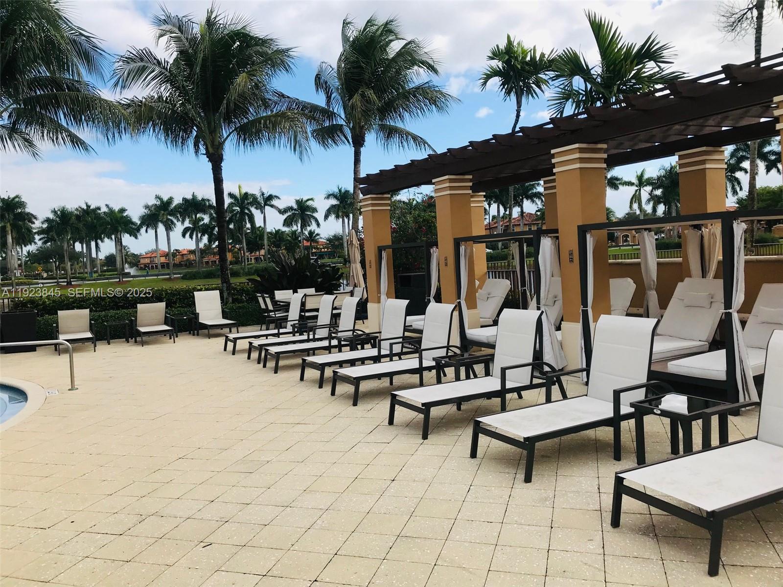 15315 Southwest 31st Terrace, Unit 15315 Miami, FL 33185 - Photo 27 of 35 a view of swimming pool with outdoor seating