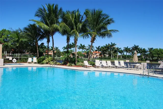 a view of a swimming pool and a chair