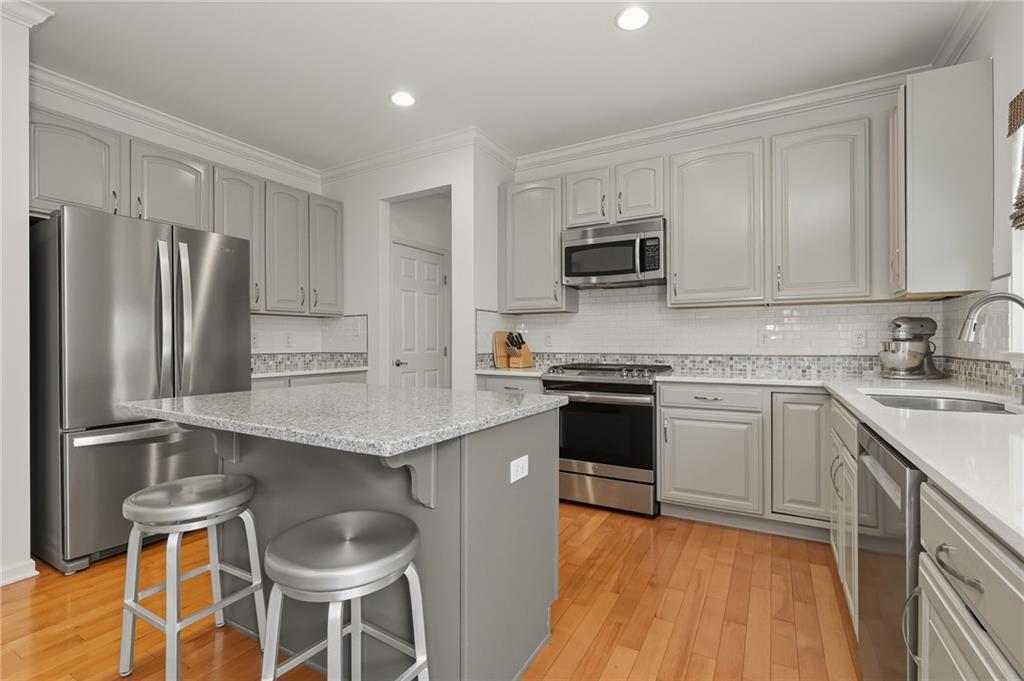 207 Windham Lane Mars, PA 16046 - Photo 11 of 43 a kitchen with a sink stove and refrigerator