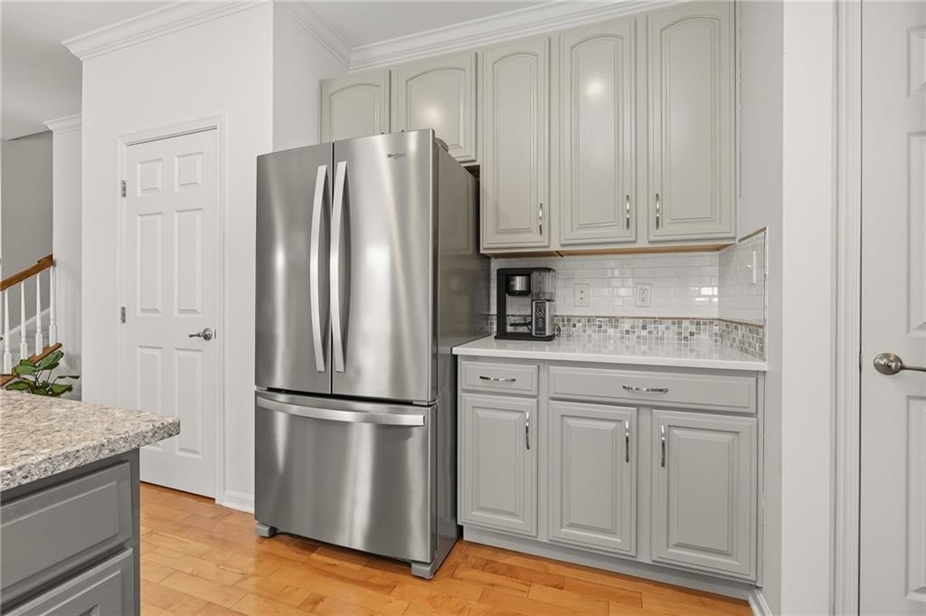 207 Windham Lane Mars, PA 16046 - Photo 13 of 43 a kitchen with granite countertop stainless steel appliances a refrigerator and cabinets