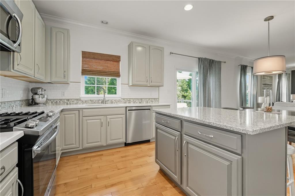 207 Windham Lane Mars, PA 16046 - Photo 14 of 43 a kitchen with a sink stove and cabinets