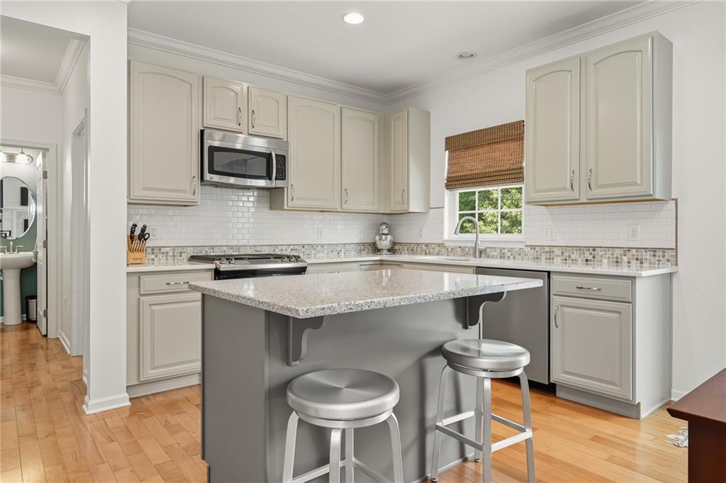 207 Windham Lane Mars, PA 16046 - Photo 15 of 43 a kitchen with stainless steel appliances granite countertop a white cabinets and a stove