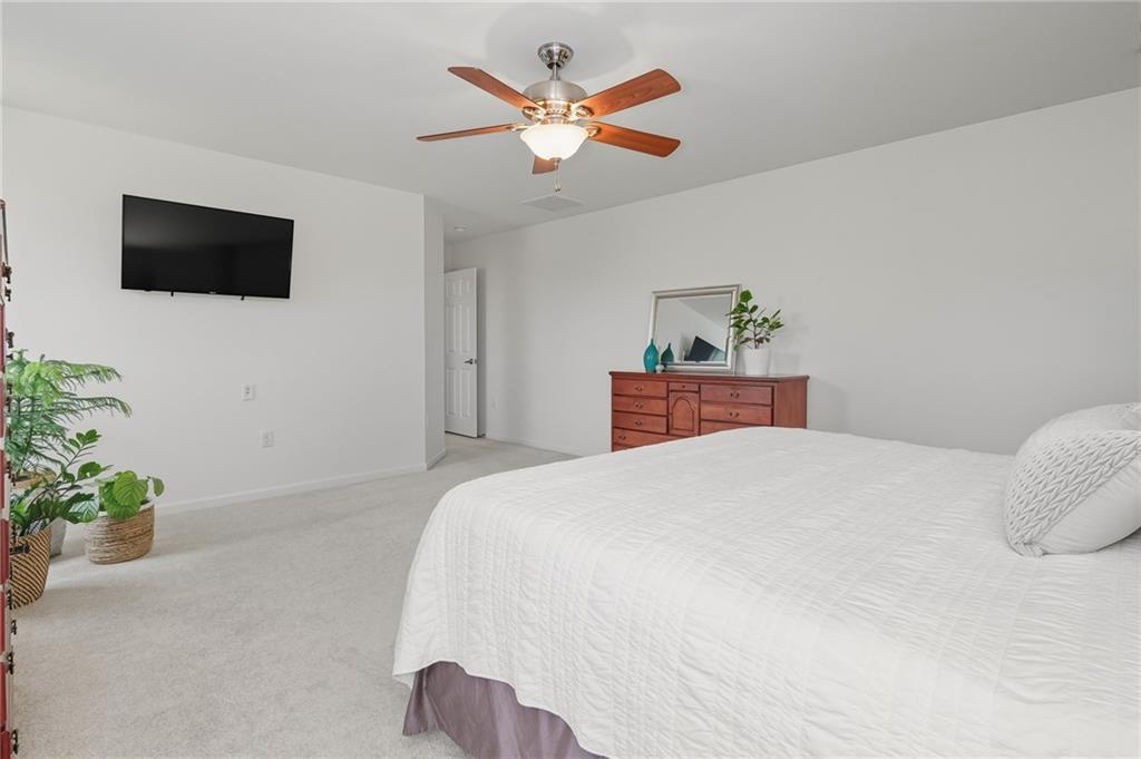 207 Windham Lane Mars, PA 16046 - Photo 21 of 43 a bedroom with a bed and a flat screen tv