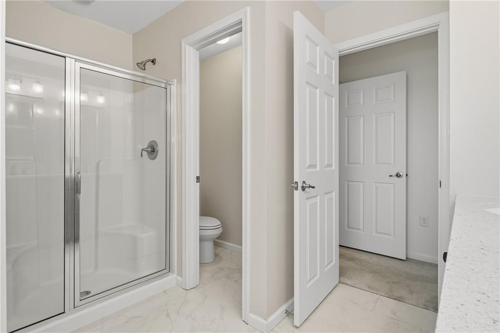207 Windham Lane Mars, PA 16046 - Photo 24 of 43 a bathroom that has a glass shower door