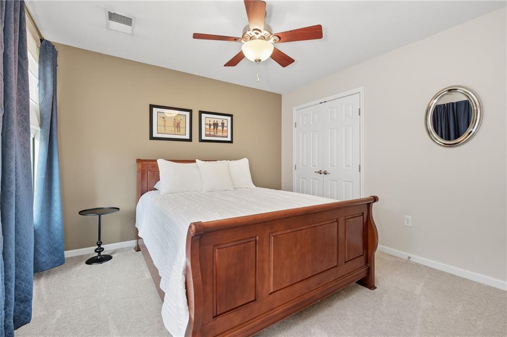 207 Windham Lane Mars, PA 16046 - Photo 27 of 43 a bedroom with a bed and a chandelier