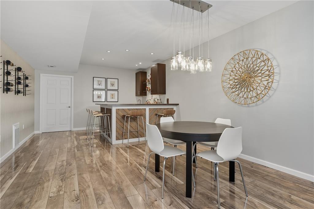 207 Windham Lane Mars, PA 16046 - Photo 33 of 43 a view of a dining room with furniture and wooden floor