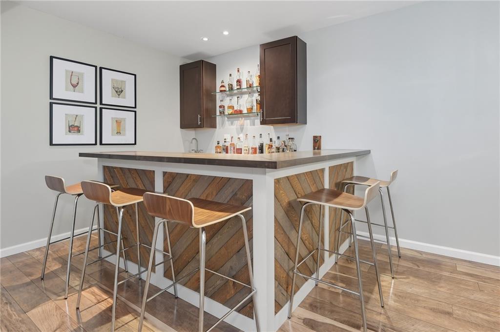 207 Windham Lane Mars, PA 16046 - Photo 34 of 43 a view of a kitchen area with furniture and wooden floor
