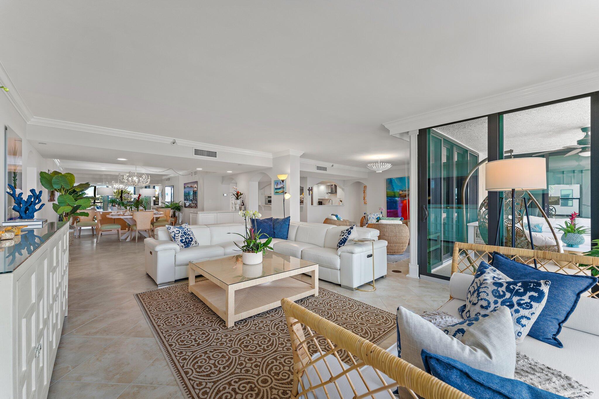 19670 South Beach Road, Unit B303 Jupiter, FL 33469 - Photo 13 of 104 a living room with furniture and a large window