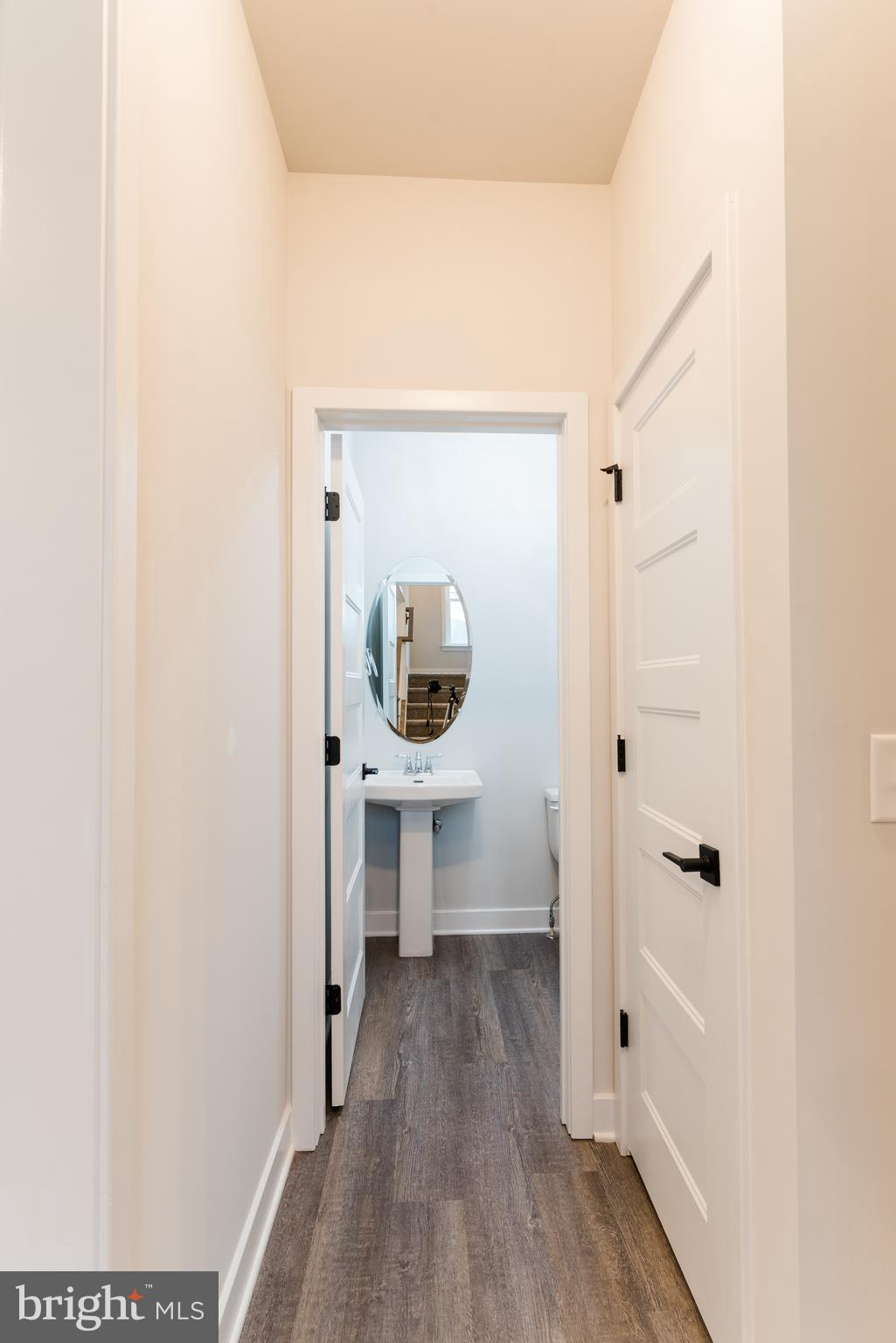 10625 Plank Road Spotsylvania, VA 22553 - Photo 3 of 26 a view of a hallway with wooden floor and staircase