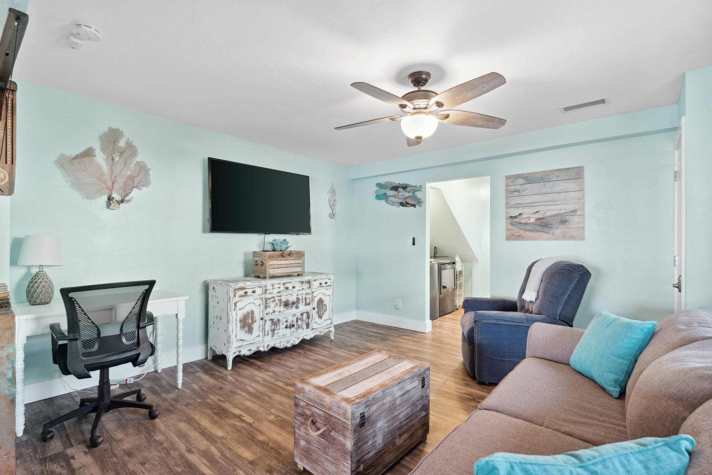129 Durango Road, Unit 1 Destin, FL 32541 - Photo 19 of 71 a living room with furniture and a flat screen tv