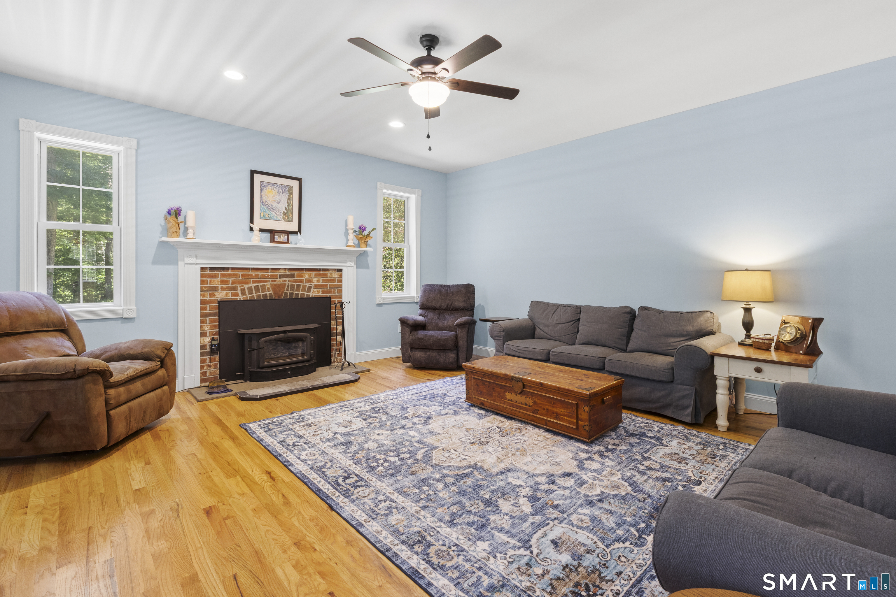 175 Cranberry Bog Road Killingly, CT 06239 - Photo 5 of 40 a living room with furniture a flat screen tv and a fireplace