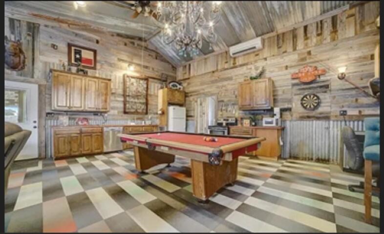 2702 Blue Creek Road La Vernia, TX 78121 - Photo 13 of 31 a kitchen with stainless steel appliances granite countertop a stove a sink and a refrigerator