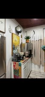 2702 Blue Creek Road La Vernia, TX 78121 - Photo 29 of 31 a kitchen with granite countertop a refrigerator and a stove
