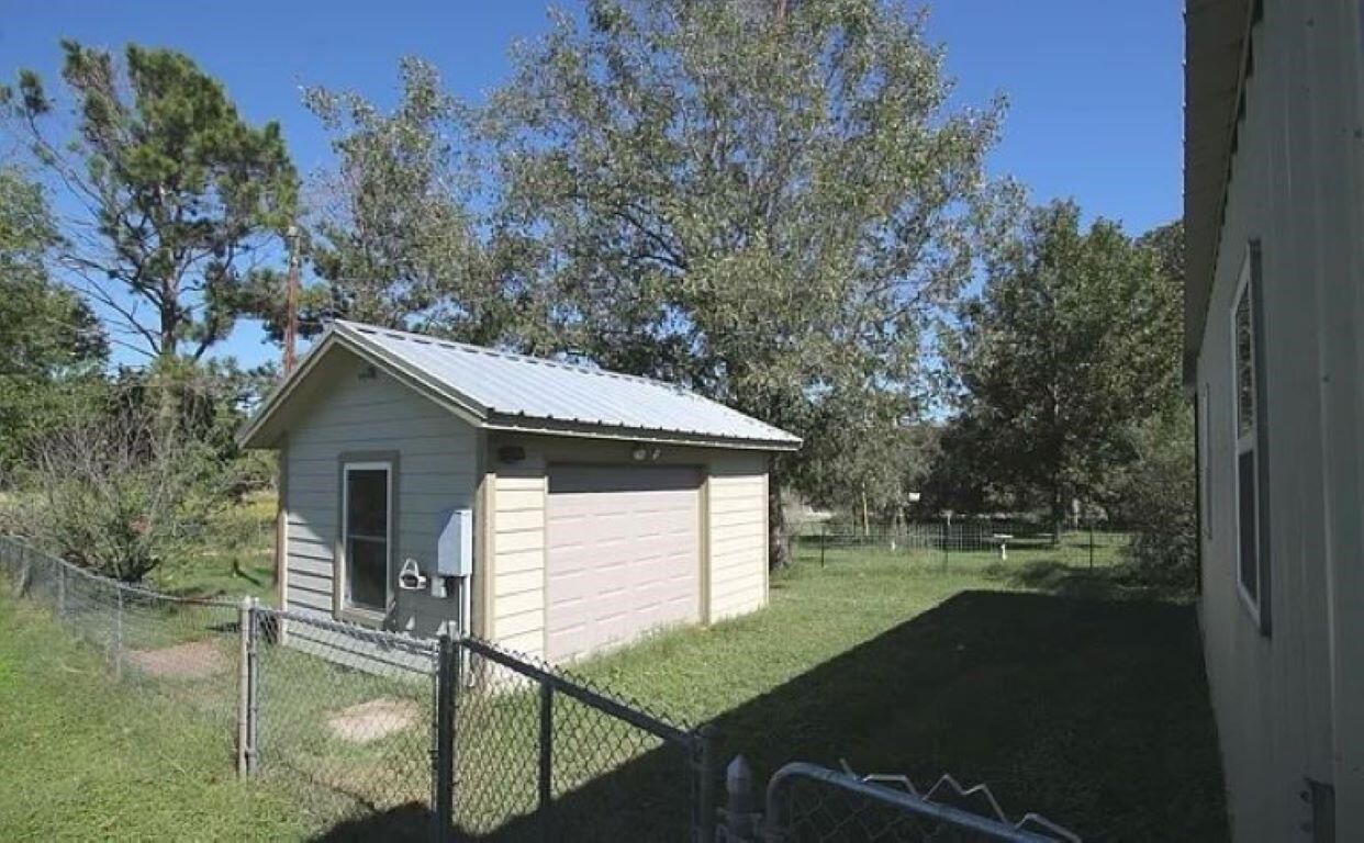 2702 Blue Creek Road La Vernia, TX 78121 - Photo 4 of 31 a view of a house with backyard and trees