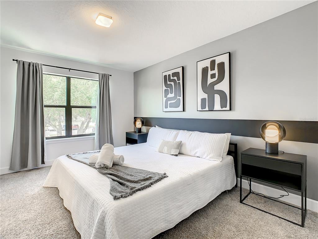 181 Villa Domani Circle Davenport, FL 33896 - Photo 18 of 37 a living room with furniture and a large window