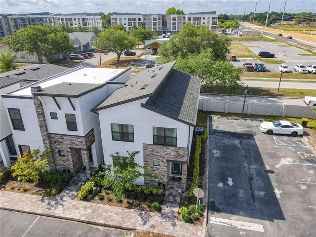 a living room with furniture kitchen view and a table