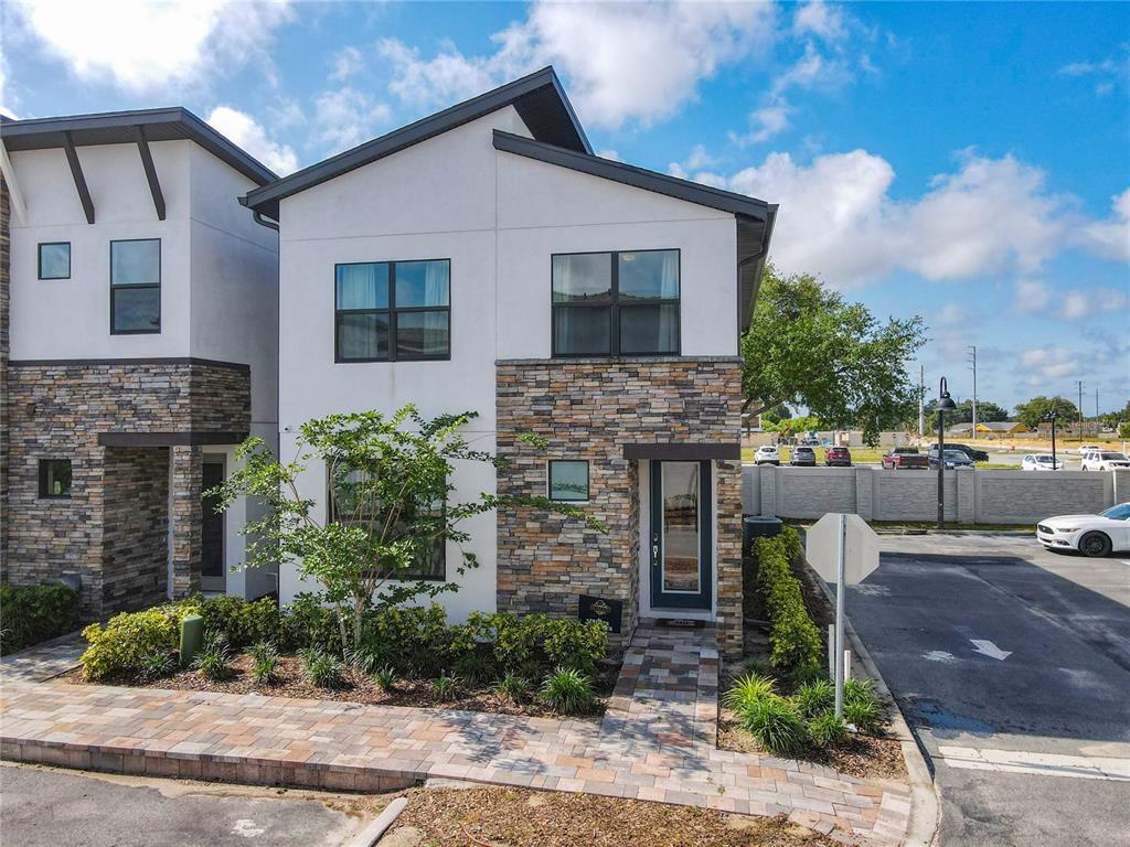 181 Villa Domani Circle Davenport, FL 33896 - Photo 34 of 37 a front view of a house with garden