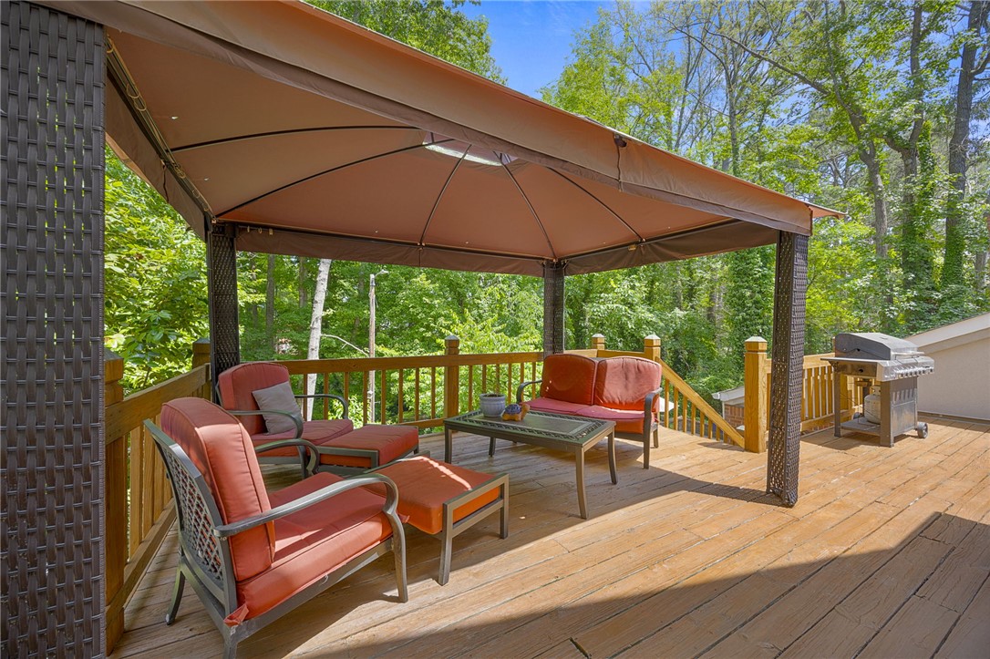 218 Northridge Drive Anderson, SC 29621 - Photo 38 of 50 A spacious wooden deck provides ample outdoor living space, perfect for relaxing or entertaining.