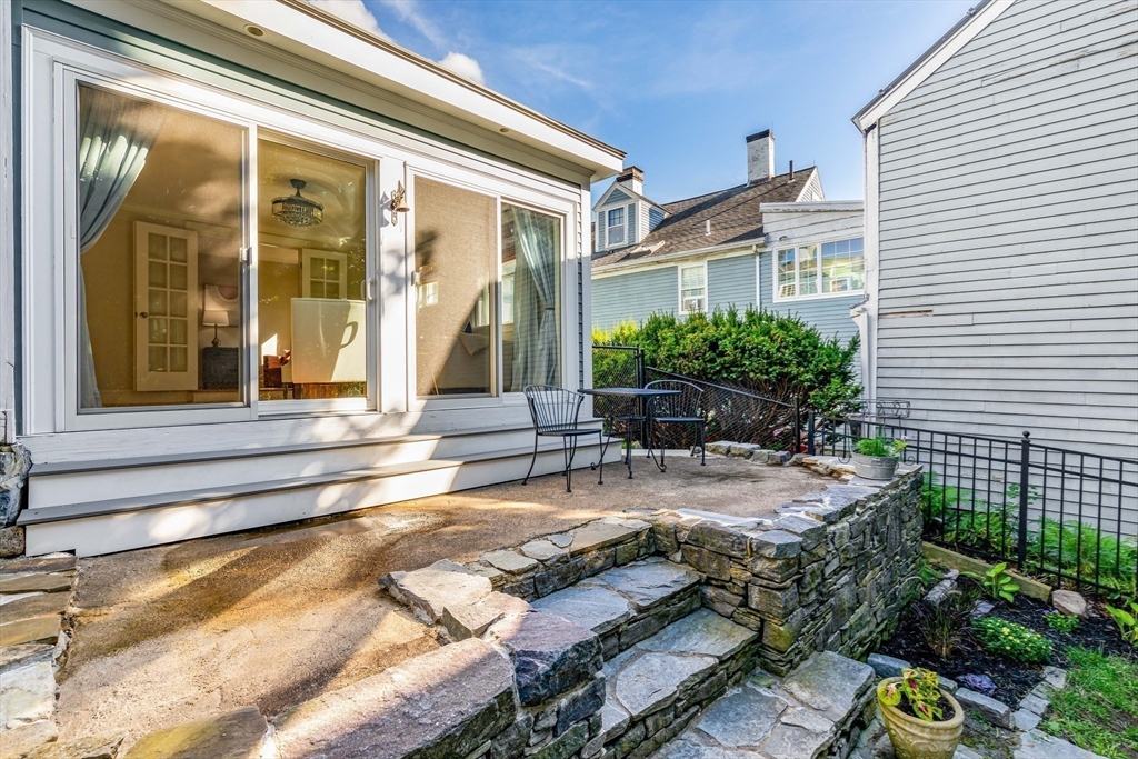 138 State Street, Unit 1 Newburyport, MA 01950 - Photo 15 of 35 a view of house with backyard and outdoor seating