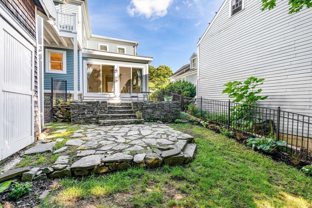 138 State Street, Unit 1 Newburyport, MA 01950 - Photo 18 of 35 a view of a house with backyard and sitting area