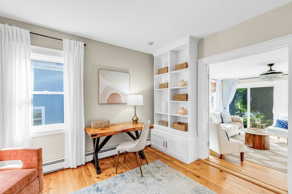 138 State Street, Unit 1 Newburyport, MA 01950 - Photo 19 of 35 a bedroom with furniture and a window