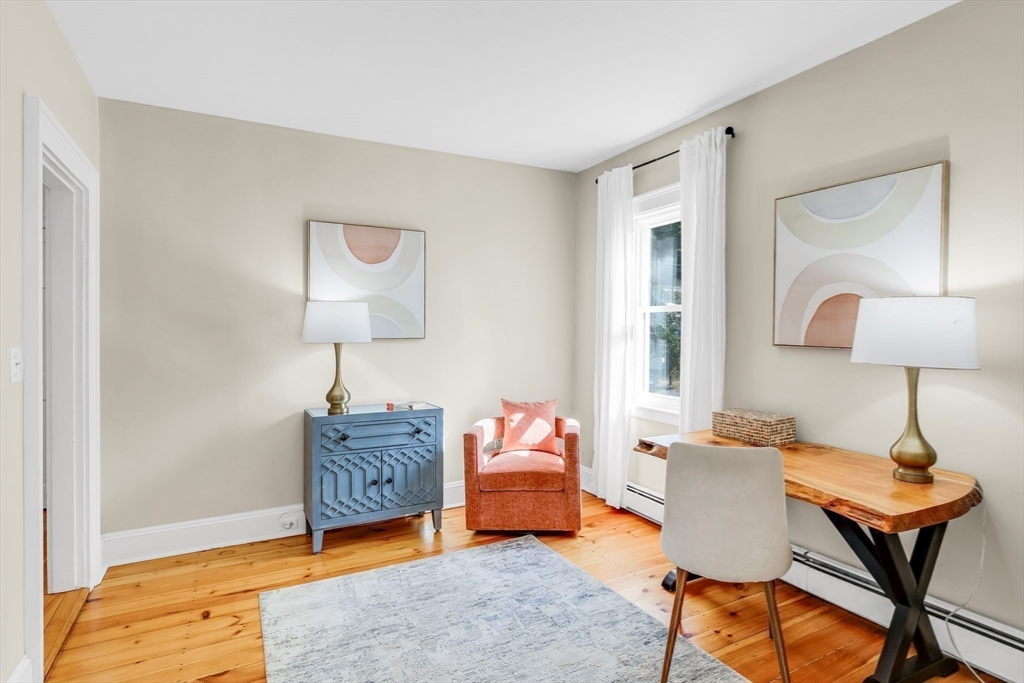 138 State Street, Unit 1 Newburyport, MA 01950 - Photo 20 of 35 a bedroom with furniture and a window
