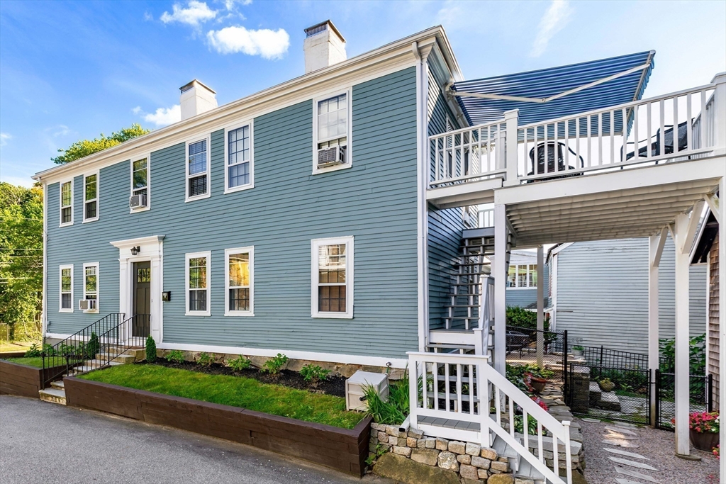 138 State Street, Unit 1 Newburyport, MA 01950 - Photo 2 of 35 front view of a house with a yard