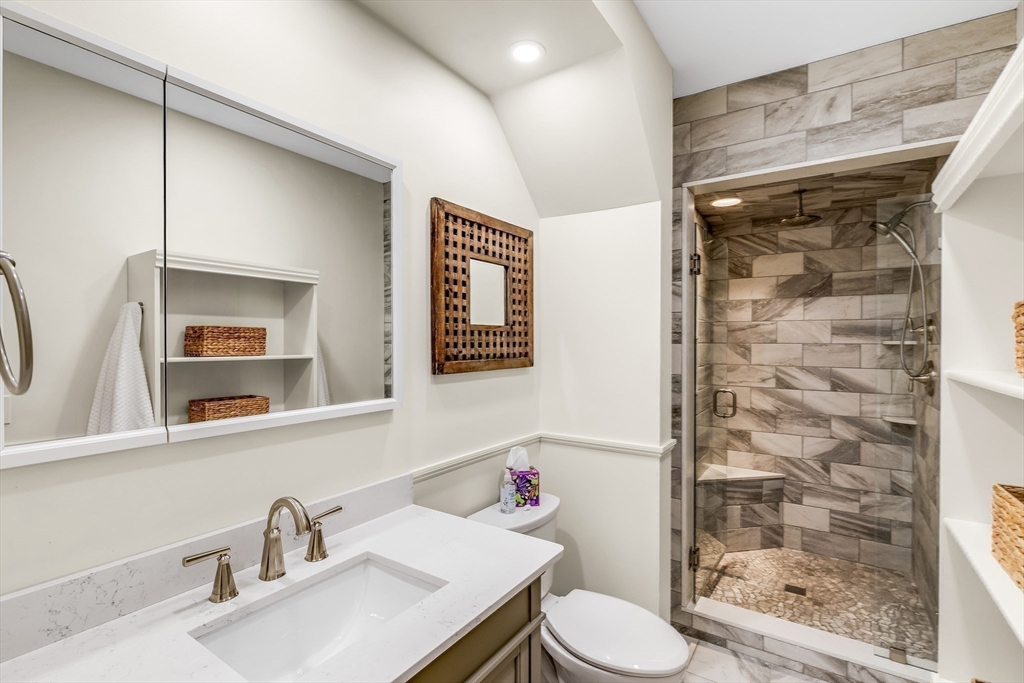 138 State Street, Unit 1 Newburyport, MA 01950 - Photo 25 of 35 a bathroom with a sink toilet and shower