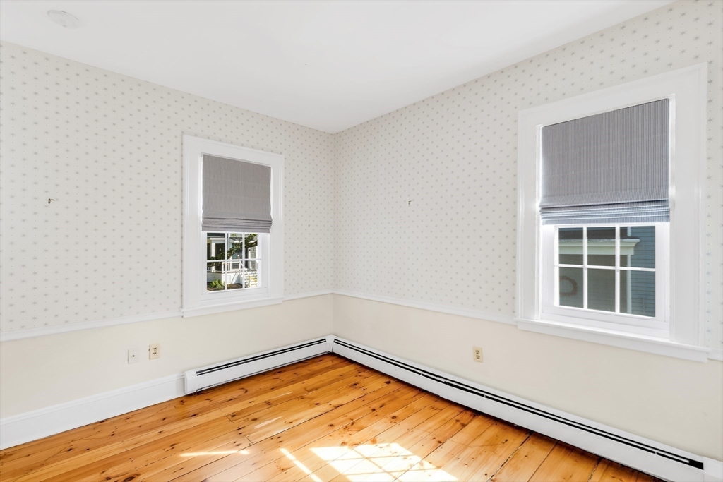 138 State Street, Unit 1 Newburyport, MA 01950 - Photo 28 of 35 an empty room with a window