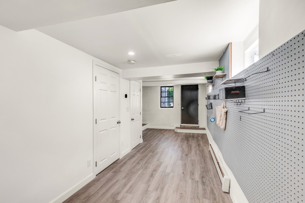 138 State Street, Unit 1 Newburyport, MA 01950 - Photo 30 of 35 a view of a hallway with wooden floor