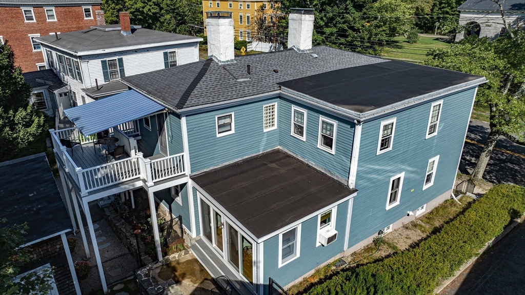 138 State Street, Unit 1 Newburyport, MA 01950 - Photo 33 of 35 a aerial view of a house with a yard