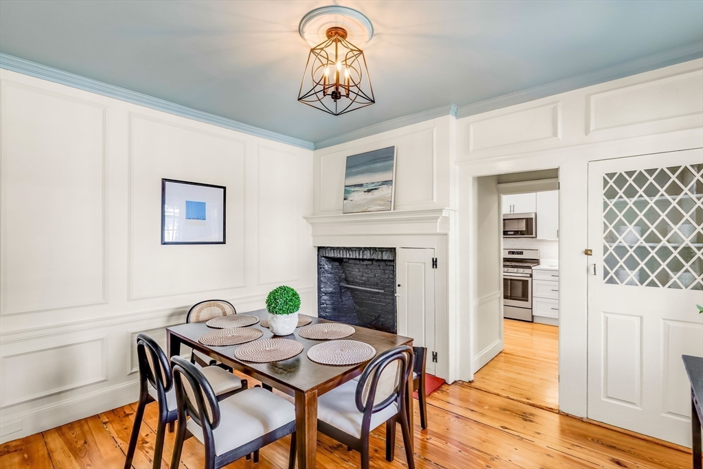138 State Street, Unit 1 Newburyport, MA 01950 - Photo 4 of 35 a view of a dining room with furniture and wooden floor