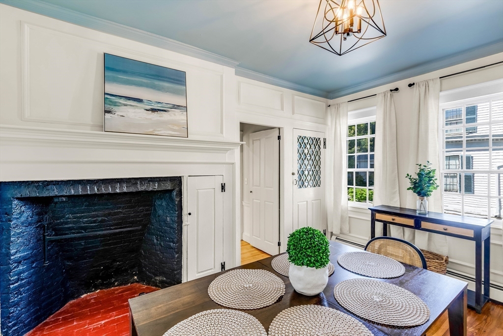 138 State Street, Unit 1 Newburyport, MA 01950 - Photo 6 of 35 a living room with furniture and a fireplace